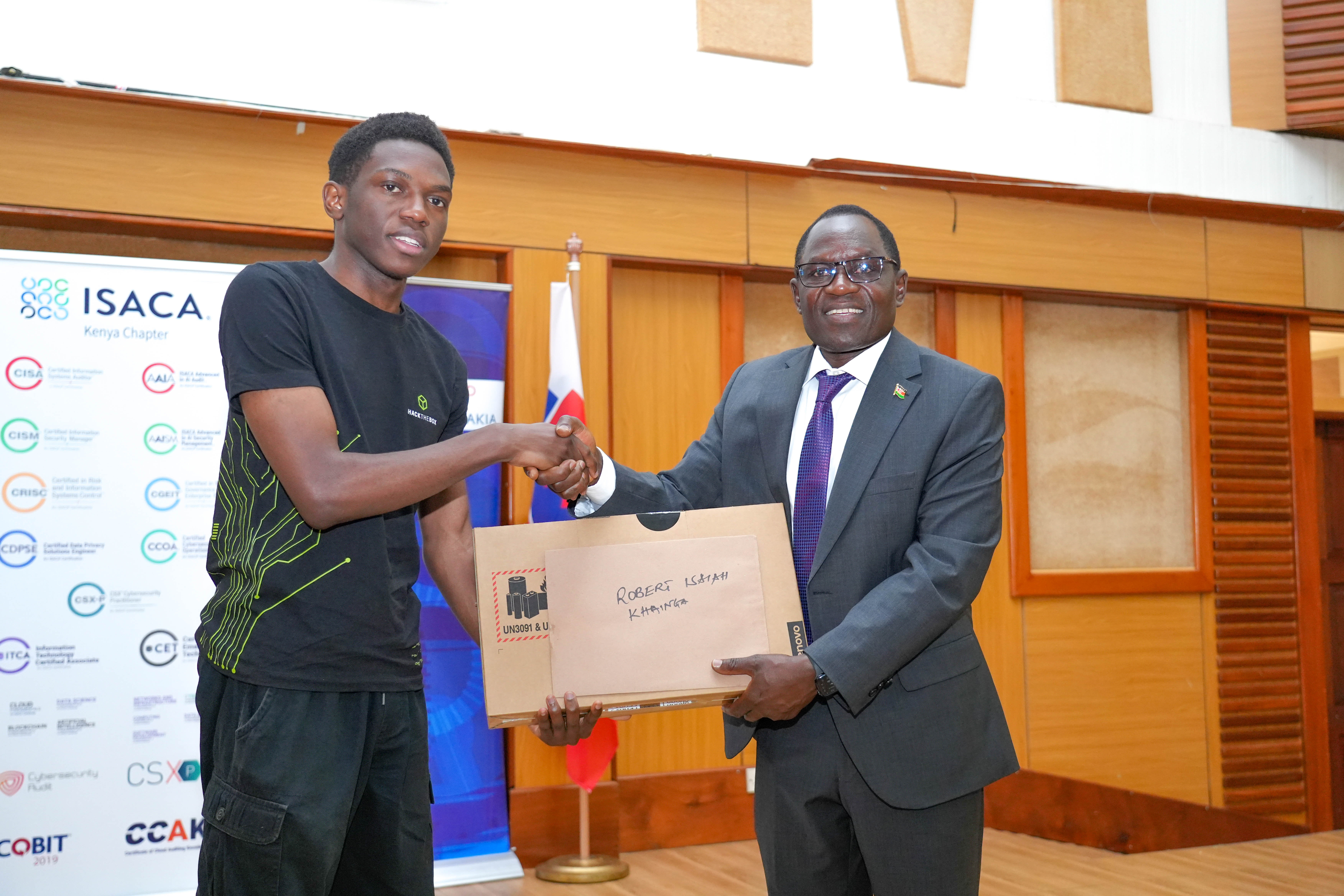 PS Stephen Isaboke awards one of the winners of the Cybergames 2026